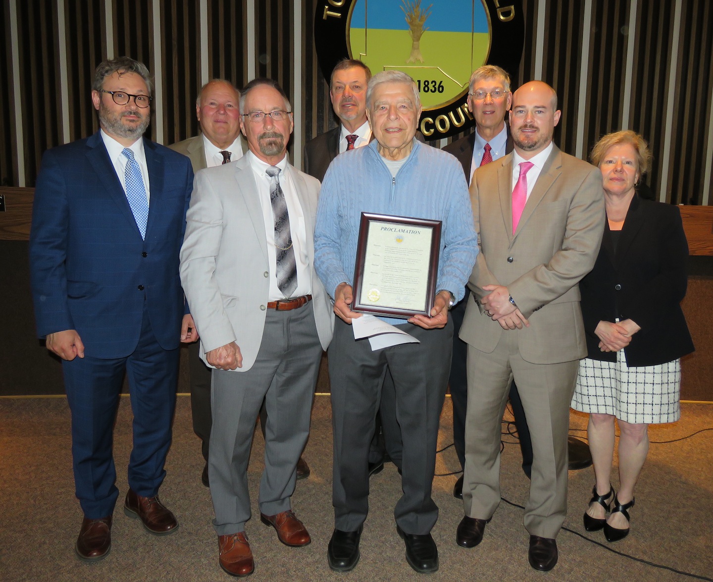 From left, Town Attorney Matt Brooks, Councilman Gil Doucet, Supervisor Don MacSwan, Councilman Randy Retzlaff, Richard Muscatello, councilmen Larry Helwig and Curt Doktor, and Town Clerk Kathy Harrington-McDonell. (Photo by David Yarger)